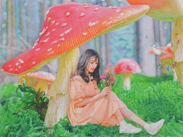 Girl sitting under the mushroom looking at the flowers